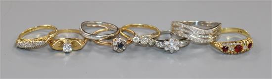 Eight assorted gold and gem set rings including diamond, 18ct(7) and 9ct(1)